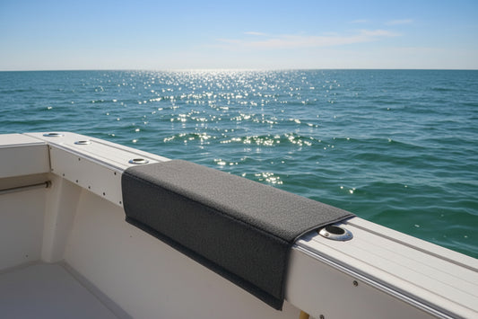 Close-up of a boat gunnel with a pad over the edge. 