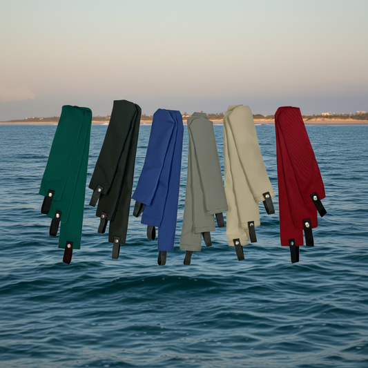 Group of colorful Sunbrella marine burgee flag covers in blue, green, and red.
